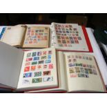 Four albums of collectable stamps including Ceylon