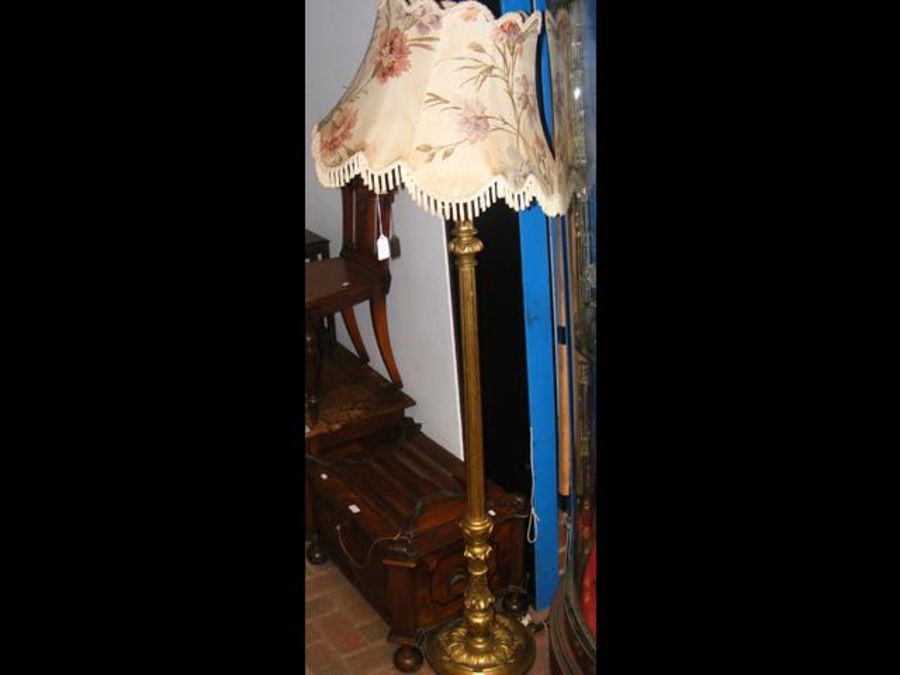 A gilt reeded standard lamp