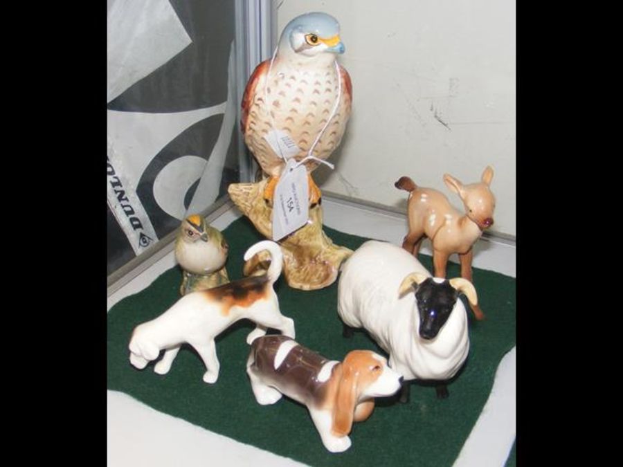 A Beswick figure of a Bird of Prey, together with
