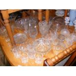 A stock of cut glass bowls, decanters etc