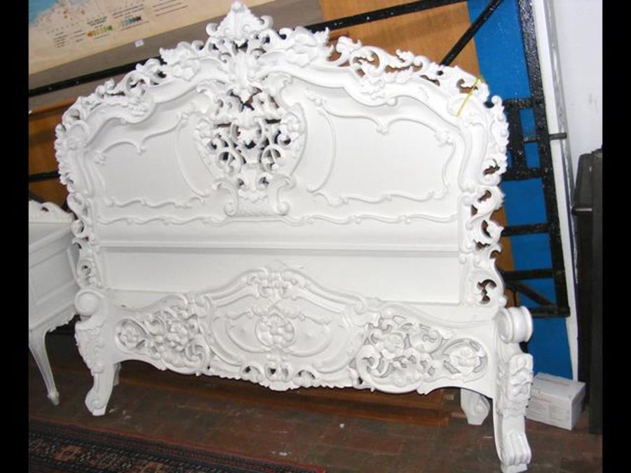 An antique French style white bedstead