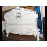 An antique French style white bedstead