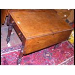 A Victorian mahogany Pembroke table on turned legs