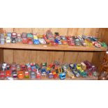 Two shelves of play worn die cast model vehicles