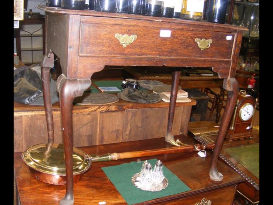 A Georgian oak side table on cabriole legs - width