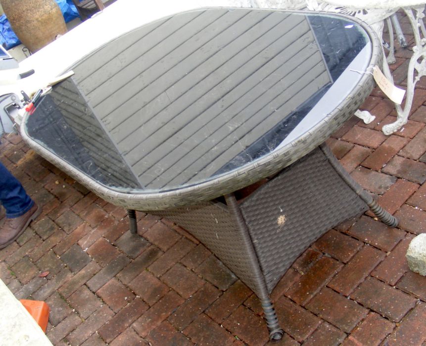 A glass top conservatory/patio table