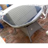 A glass top conservatory/patio table