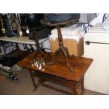 A two tier coffee table together with two ornate o