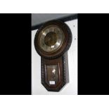 A 1920's wall clock with gadrooned edging