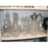 A cluster of cut glass decanters