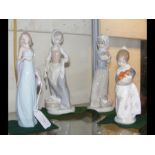 Two Lladro female figures, together with two Nao f