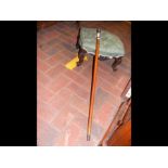 A footstool and walking stick