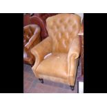 A Victorian style button back easy chair