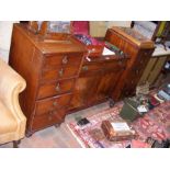 A mahogany sideboard with drawers flanking central