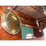An early 19th century brass and copper warming pan