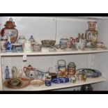 Two shelves of Oriental ceramics