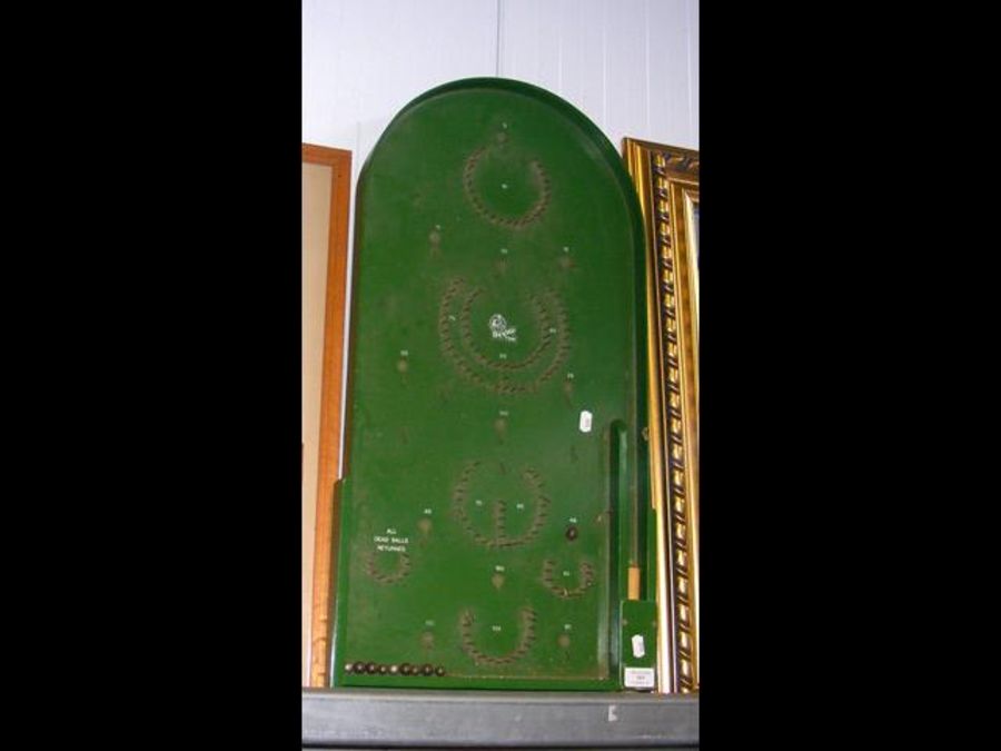 A vintage bagatelle board, together with a selecti