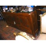 An Oriental style sideboard with decorative hinges