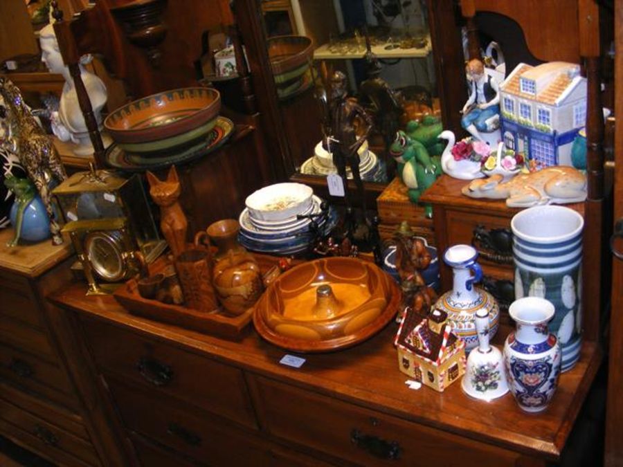 An assortment of collectable ceramic and metal war