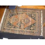 A Middle Eastern style rug with geometric border a