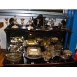 A quantity of silver plated serving ware and cande