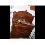 A Victorian mahogany chiffonier with shaped back a