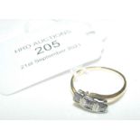 A three stone diamond ring in gold setting