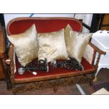 An earlier 20th century two seater settee with woo
