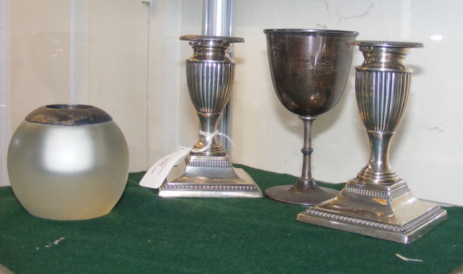 A pair of silver candlesticks, wine cup and vesta