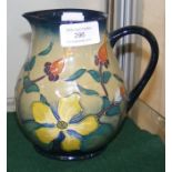 A Moorcroft pottery jug with tube line floral deco
