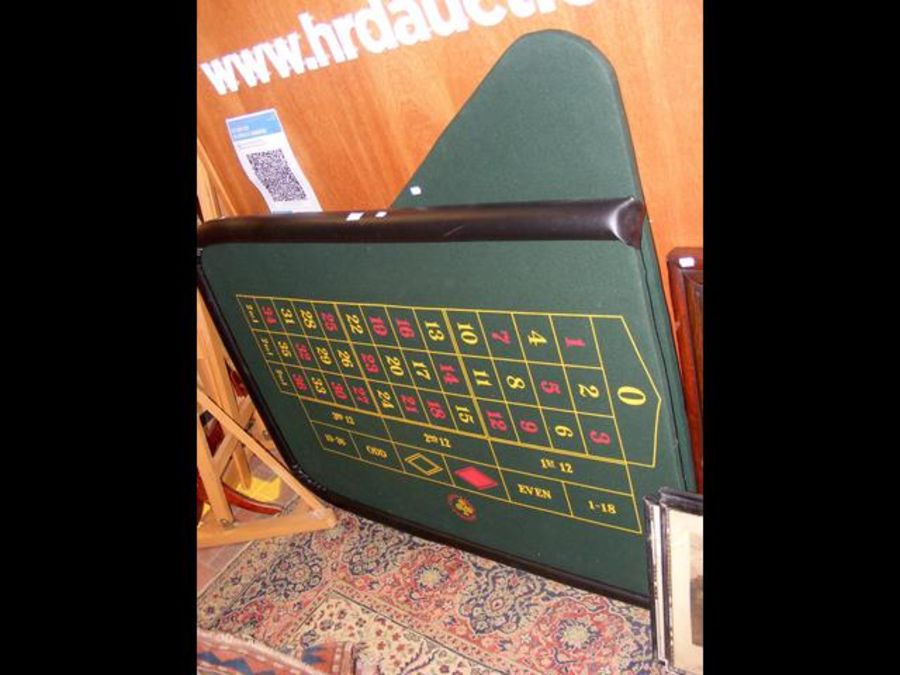 A mobile roulette table featuring Grosvenor Casinos felt