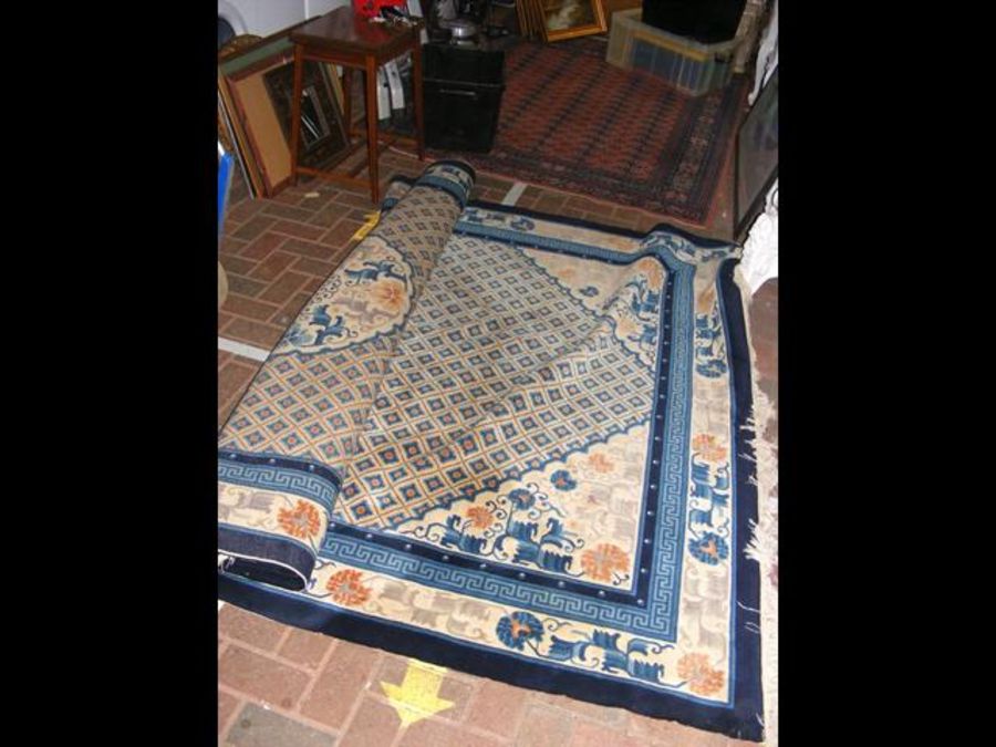 A large Chinese style carpet with geometric border