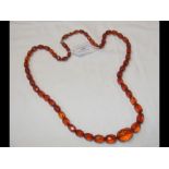 A faceted amber necklace - length 84cm