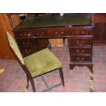 A pedestal desk with green leather inlay, together