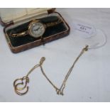 A ladies gold wrist watch together with chain and
