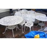 A circular painted aluminum garden table and chair