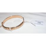 A 9ct gold engraved bracelet with safety chain