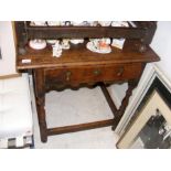 A period oak side table on turned supports