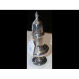 An 18cm high silver sugar shaker