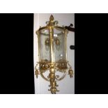 A decorative cast brass and glass porch lamp - 100