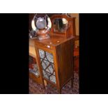 An Edwardian display cabinet with mirrored back