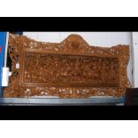 A carved wooden plaque - 140cm x 70cm
