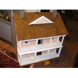 A doll's house with tiled roof and veranda - width