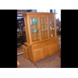 A modern light wood display cabinet with glazed up