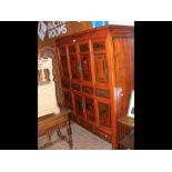 An Oriental japanned cabinet with stylised doors a