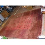 A large Middle Eastern rug with geometric border -