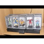 Ten boxed Marvel figures with stand