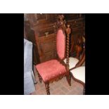 An antique hall chair with barley twist back-rest
