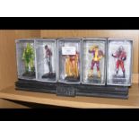 Ten boxed Marvel figures with stand