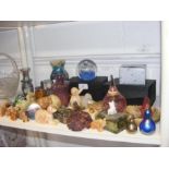 A medley of glass paperweights, Wade Whimsies, etc.